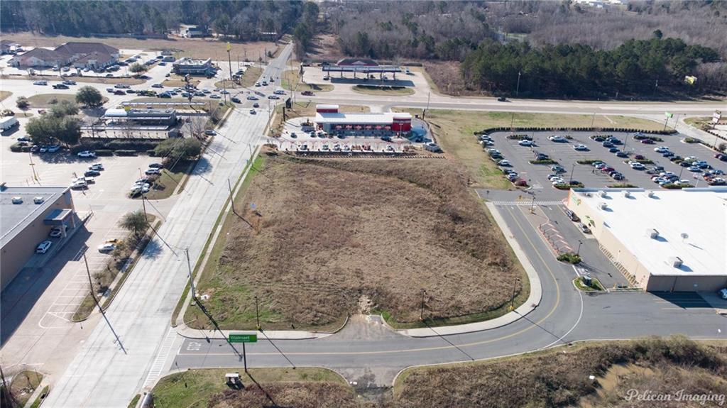 Experience the potential of this expansive, nearly 2-acre property conveniently positioned at the bustling northwest corner of two eminent traffic arteries, Bert Kouns and Linwood Road. With a diverse range of both retail and residential developments in the immediate vicinity, the location promises an inherent market for your venture. Boasting an unusually high traffic count, this location guarantees profound business exposure. Perfect tract for a restaurant, strip center, offices, etc. It's the ideal site for any commercial development due to its prime positioning and built-in customer base, ensuring your venture will be extremely visible. 
The exceptional geographical advantage is further improved by its proximity to well-established, large-scale businesses like Walmart and Thrifty Liquor. Sidling up next to these popular go-to points ensures your business gets prevalent exposure to a steady stream of potential customers.  An additional 82 acres of available land expands the field of possibilities. Also 8 commercial pads are available.