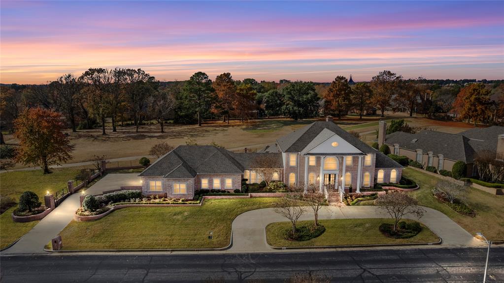 Welcome to your new sanctuary of luxury, situated within the prestigious Hollytree Country Club community, where sophistication meets unparalleled comfort. This meticulously renovated 6,221 sq ft estate is designed for discerning individuals who embody the country club lifestyle.

As you step into the grand foyer, you are greeted by a stunning 1900's restored chandelier that set an elegant tone for this exquisite residence. The home boasts five spacious bedrooms, including a sumptuous owners suite that offers breathtaking views of the golf course. The owners bath is a true retreat, featuring a lavish soaking tub, a bespoke shower with multiple heads, and an expansive walk-in closet complete with a hidden cedar closet.

Entertain guests in style within the gourmet kitchen, equipped with high-end appliances, a gas stove, and a generous island perfect for culinary creations and social gatherings. The warmth of five fireplaces throughout the home, including a dedicated office with built-ins and a stunning pass-through fireplace, creates an inviting atmosphere for both work and leisure.

For family and friends, a ground-floor mother-in-law suite offers privacy and comfort, complete with a separate living room and 1.5 baths. Movie nights will be a delight in the state-of-the-art theater room, featuring plush seating and top-tier sound technology.

Stay active in your private gym or unwind on the covered back patio, overlooking the lush greens of hole 8. The outdoor grill makes alfresco dining a breeze, providing the perfect backdrop for unforgettable gatherings.

With a three-car garage, two dining areas, and a detailed focus on luxury throughout, this residence is not just a home; it is a lifestyle choice for those who appreciate the finer things in life. Discover unparalleled living where elegance meets comfort—your dream home awaits!