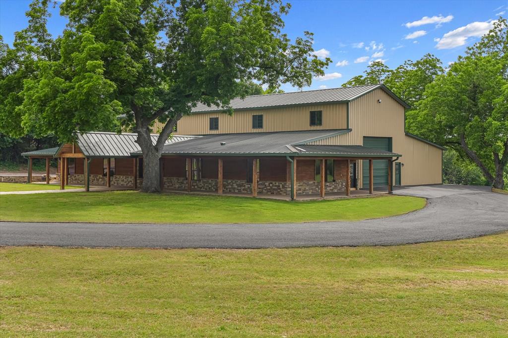 The beautiful property is situated on 18 acres just 15 minutes from McKinney, Tx.The master bedroom includes a walk in solid cedar closet.The master bathroom includes a large walk in shower with a natural stone seat. A two person jacuzzi tub with a heater, bidet toilet and two separate sinks.Two additional bedrooms each with full private bathroom. The upstairs is a large 1,080 sq ft media room with a half bathroom.The living space includes two heat pellet stoves.The large 5,000 sq ft attached shop features one 11 ft door and one 14 ft door on the ends of the shop to support a large motorhome, boat and other toys with plenty of extra work space in the workshop.This property includes access to Sister Grove creek. Next to the creek is an outdoor track that is perfect for motocross and side by side ATV and even RC toy cars. Two ponds are located on this property. 9,000 total sq ft