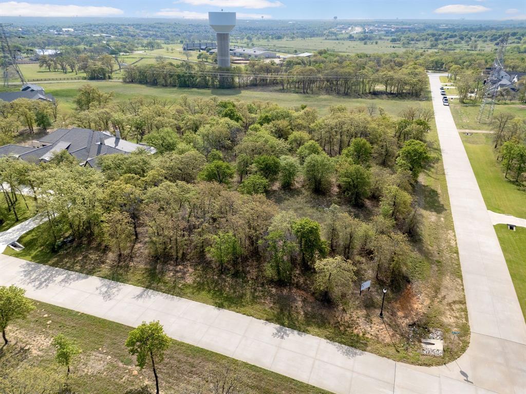 Rare opportunity to build your dream home in the prestigious Hat Creek Estates. Build with 5L Construction or bring your own builder.  Situated on just over 2 acres, this prime corner lot offers the perfect blend of privacy and natural beauty—backing to a serene greenbelt for added tranquility and views. Fully equipped and ready for development, the property includes septic, city water, electric, and gas already in place, streamlining the building process. Whether you’re looking to design a custom estate from the ground up or take advantage of a thoughtfully planned spec home opportunity, this homesite offers flexibility to suit your vision. As one of the last remaining lots in this highly sought-after community, this is a rare chance to secure your place in Hat Creek Estates. Located within the highly acclaimed Argyle ISD and just minutes from local amenities, this property delivers both convenience and a true luxury lifestyle setting. Don’t miss the opportunity to create something exceptional in one of the area’s most desirable neighborhoods.
