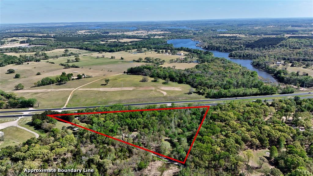 Located just outside the city limits, this 7.75-acre property offers the perfect blend of privacy, income potential, and room to grow. The land features a beautiful mix of woods and open areas, along with a spring-fed pond that adds both charm and functionality. The spacious main home has been recently updated and is currently income-producing as a rental. Improvements include a new roof (2020), 460’ deep well (2020), Hardiplank siding and new windows (2021), a wood-burning hearth (2022), and a bedroom and bathroom addition (2023). Additional upgrades include a detached 16’x24’ garage (2024), fenced garden with cedar greenhouse (2024), and a new air conditioner (2024). A newly constructed tiny home, currently operating as a short-term rental, provides excellent flexibility for additional income, guest accommodations, or multi-generational living. Completed in 2024, it features all new construction and appliances, plus major infrastructure updates including new electric service, waterline, aerobic system (2025), propane tank and lines, fencing, and a newly poured driveway (2025). With multiple living spaces, strong rental potential, and plenty of room to build or expand, this property is ideal for investors, homesteaders, or anyone seeking a private country setting with modern conveniences already in place.