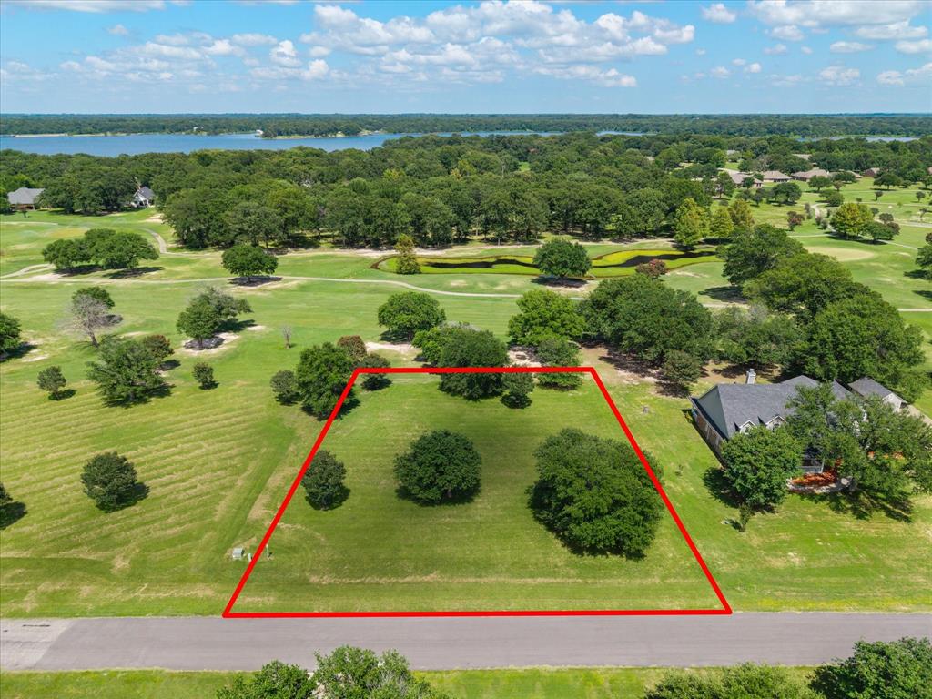 Build your dream home on this exceptional homesite overlooking the beautiful Lake Fork Golf Course! Enjoy the perfect blend of peaceful country living and resort-style amenities in this family-oriented community. The challenging 18-hole golf course features a full-service clubhouse, making it easy to spend the day golfing, dining, and relaxing close to home. Located on the west banks of the world-famous Lake Fork Reservoir, known as the Bass Capital of Texas, you’ll have incredible fishing and boating opportunities just minutes away. Conveniently situated only about an hour from the DFW Metroplex, this build-ready lot offers the ideal escape for a weekend retreat or your forever home. Don’t miss this opportunity to own property in one of East Texas’ premier golf and lake communities.