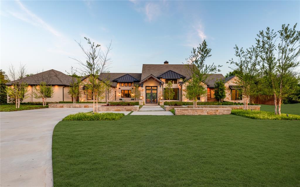 Tucked behind a secluded cul-de-sac in Stonebridge Ranch, this custom single-story estate by renowned builder GG Cain sits on a rare, fully treed acre lot where nature surrounds every corner and privacy is absolute. Inspired by the Texas Hill Country and finished to resort-level standards, this home has never been publicly offered for sale. There is nothing else like it in McKinney.

A private front courtyard with a tranquil fountain sets the tone upon arrival. Inside, soaring ceilings and walls of glass blur the line between interior living and the lush, mature landscape beyond, with every room intentionally positioned to capture the natural setting that surrounds it. The chef's kitchen is both a statement and a gathering place, featuring custom cabinetry, elevated finishes, a butler's pantry, and a designer-tiled built-in bar that is equal parts function and showpiece. A dedicated movie room, private office, and lodge-inspired flex living space complete an interior designed for deep comfort and effortless entertaining.

The primary suite is a world apart, a private wing with a spa-caliber bath, soaking tub, separate vanities, walk-in shower, and a custom closet. A private outdoor shower and dedicated yoga and relaxation garden extend the retreat beyond the walls of the home. Every additional bedroom is a fully ensuite suite, with a separate pool bath serving the outdoor living areas.

Outside, an infinity-edge pool anchors an experience that feels more private resort than residence. Professional landscaping, mature trees, and curated outdoor lighting create an atmosphere of serenity both day and night. A peaceful yoga garden, turfed dog run, and separate pet fencing ensure the grounds are as livable as they are breathtaking. Three-car garage and extended guest parking complete the picture. This is not just a home. It is an experience. A private retreat. A place that feels like a vacation every single day.