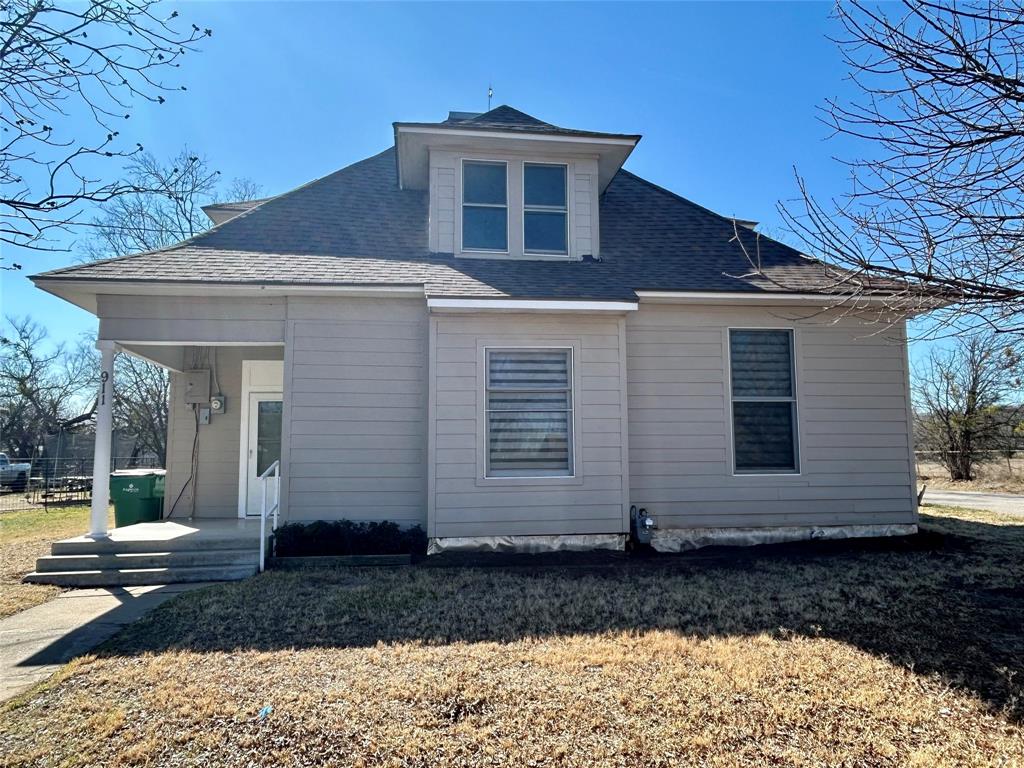 Well-maintained with recent improvements, 2-story home offering 1,778 sq ft of functional living space on a spacious 0.35-acre corner lot. The main level features a welcoming front entry, comfortable living room, and a separate kitchen and dining area with access to the backyard. One bedroom and one full bathroom are located downstairs, along with a large utility room that provides exterior access to the back patio. The downstairs bedroom includes two closets, one of which is a generous walk-in closet. Tall ceilings and new vinyl flooring enhance the main living areas. The kitchen offers abundant wood cabinetry, an island with storage, gas cooktop, single wall oven (approximately 2 years old), dishwasher (approximately 3 years old), and refrigerator. A gas water heater was replaced approximately one year ago.
Upstairs includes two bedrooms with new carpet and a full bathroom featuring a stand-alone shower. Interior walls have been freshly painted in neutral gray and white tones, and new blinds have been installed in the living room. The home is equipped with space heaters and window units for heating and cooling.
The exterior offers exceptional versatility with a 30x40 metal detached shop featuring two garage bay doors, concrete flooring, and electricity. A chain-link fenced backyard includes one additional storage building, which is well-suited for an office, hobby space, or small business use. Composition roof and wood siding replaced in 2024. 
Located in the thriving small community of Coleman, known for its warm and welcoming atmosphere, charming boutiques, local restaurants, entertainment venues, and numerous recreational opportunities. Coleman’s central Texas location allows for convenient access to several major cities within an easy three-hour drive.