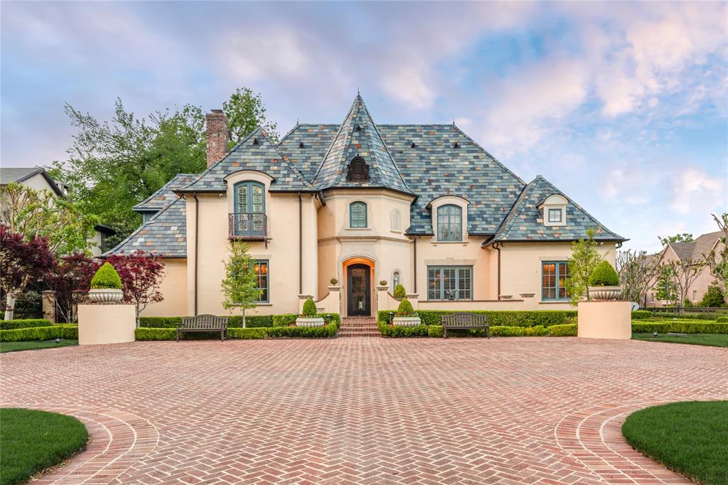 Timeless Elegance, Resort Style Living!  7,746+ sq-ft pier & beam estate crowned by multicolored slate roof & copper gutters situated on 100 x 228 National Award Winning Landscaped corner surrounded by custom wrought iron fence & gates. Impeccably crafted cathedral ceilings, millwork, exquisite chandeliers & surfaces, high end appliances & 6 fireplaces in this one-of-a-kind 6 Bed, 5.2 Bath, Living, Library, 2 Dining, Family, Chef's Kitchen, Sunroom, Game, Media, 2 Wet Bars, 2 Dry Bars, Utility, Gift Wrap, Loggia featuring Grill Kitchen with HVAC, 3 Car Garage with HVAC, 6 Car Motor Court, Multiple Patios, Spectacular Pool, Bridge, Waterfall, Sunken Seating, Fireplace, Large Grass Area, Dog Run & Extensive Landscape Lighting.