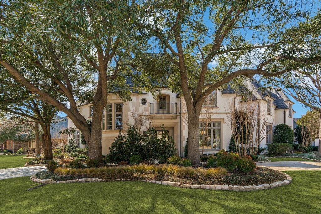 Situated on a prime corner lot in prestigious Creeks of Willow Bend, this exquisite home has been extensively remodeled with high-end finishes throughout. A circular driveway and lush landscaping enhance its impressive curb appeal. Inside, a grand two-story living room with Venetian plaster walls sets the tone for elegance. The gourmet kitchen features custom black-and-white cabinetry, quartzite counters, under-counter and pendant lighting, and top-tier appliances, including a built-in SKS refrigerator, two double ovens, two dishwashers and Miele microwave oven, a 48” SKS gas range with induction and sous vide burners, and a Scotsman ice maker. An adjoining breakfast nook offers additional seating for informal dining and enjoying views of the outdoors.  A spacious family room boasts a striking gas fireplace and an updated wet bar with a full-height SKS-paneled wine fridge. The luxurious primary suite includes a sitting area, spa-like bath with a steam shower and freestanding tub, and a custom walk-in closet. A coveted first-floor guest bedroom adjoins a full bath and has a built-in desk and storage that can double as a 2nd office or craft room Upstairs, a game room, study nook, media room with wet bar, and three large bedrooms with remodeled baths with Ann Sacks tile and Kallista plumbing fixtures provide ample space. White oak flooring extends throughout, with carpet only in the media room. The private backyard is an entertainer’s paradise with a pool, spa, reflection pool, putting green, and artificial turf lawn. A covered patio features a built-in grill, fireplace, and TV. Additional amenities include a gated driveway, three-car garage, mudroom, security system, and Control4 whole-home audio. A perfect blend of luxury and comfort in a prestigious location!