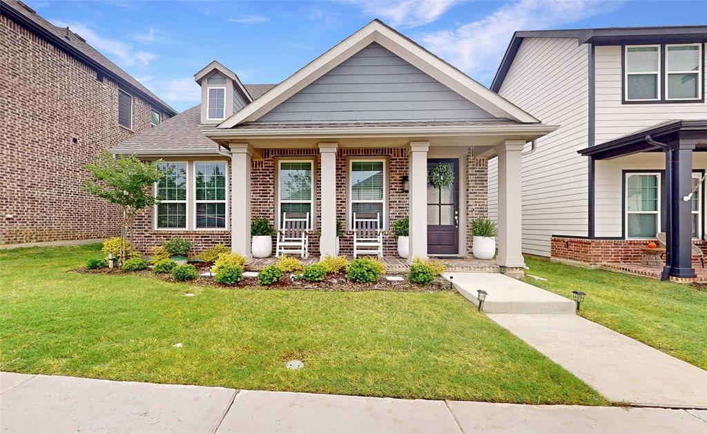 Meticulously maintained single-story in Pecan Square! Immaculate landscaping with a beautiful brick elevation and spacious front porch highlight the drive-up appeal of this home! Inside you will find three bedrooms, two full baths, and 2-car garage! Upgrades and amenities include neutral paint tones throughout, gorgeous luxury vinyl flooring throughout main living areas, an abundance of natural lighting, open concept kitchen and living area perfect for entertaining, split bedrooms for added privacy, upgraded lighting fixtures, convenient laundry built-ins, and MORE! Gourmet kitchen boasts a large island with breakfast bar and pendant lighting, quartz countertops with a subway tile backsplash, added coffee bar with butcher block countertops, stainless appliances including a gas cooktop, and eat-in area. Primary bedroom secluded at the rear of the home offers a luxurious ensuite bath with dual sink vanity, shower with bench seating, large linen closet, and generously-sized walk-in closet. Two-car rear entry garage has been fully insulated and has epoxy flooring. Private backyard is complete with an expansive covered patio and extended deck!