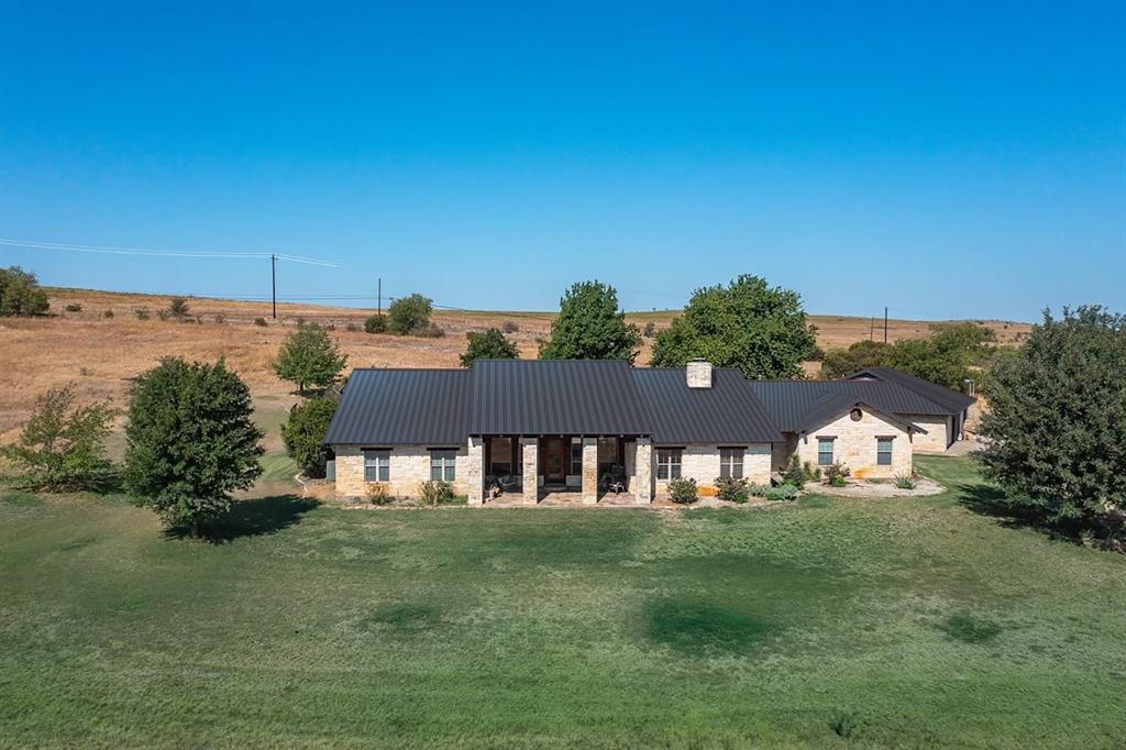 An architectural MASTERPIECE combining rustic yet modern luxury with a relaxed, livable style now also being offered on 8 acres PLUS a custom built barn allowance included in the heart of some of Aledo's most desirable horse properties! Modern Ranch Style Refined -- Superbly built with great Texas Tuscan flair and gorgeous finishes throughout including impressive rock work, 4 masonry stone fireplaces, gleaming concrete floors, soaring ceilings and freestanding stone bar in great room! Also includes detached 1 bedroom,1 bath guesthouse with full living and kitchen, resort-style pool with grotto and waterfall feature, spacious 4 car garage, and inviting covered porches to enjoy its great views of rolling countryside! Owner offering an allowance for barn construction. ***Seller is in the process of completing substantial upgrades!