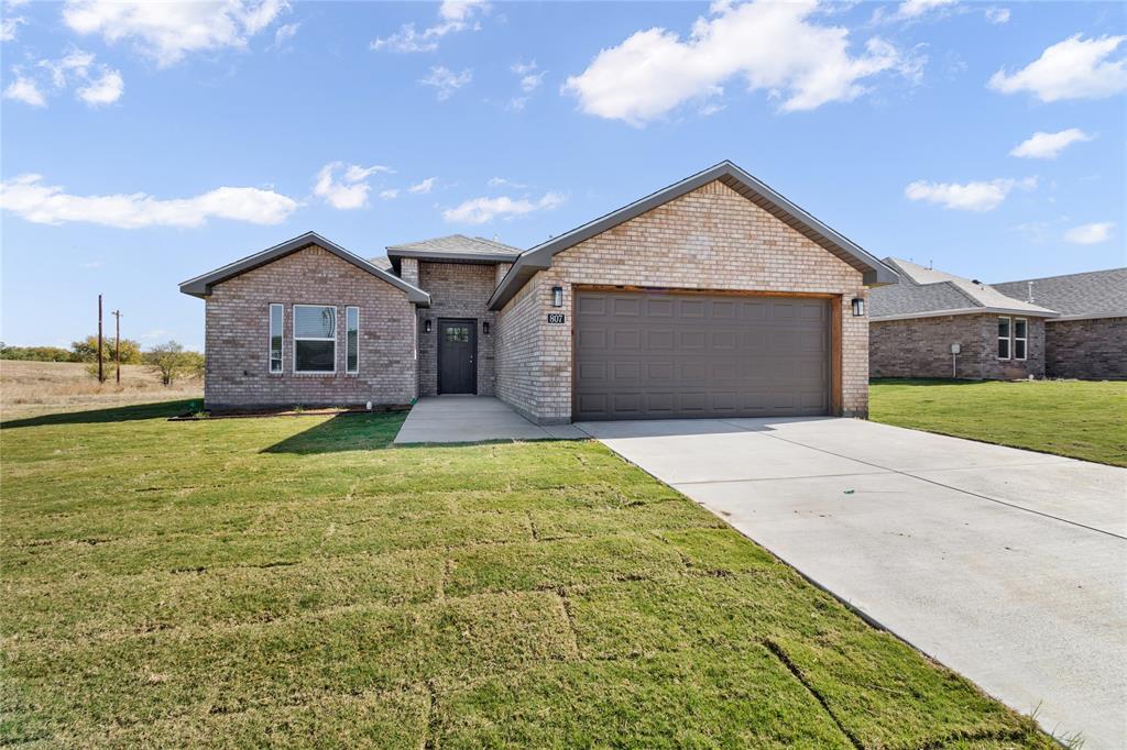 Beautiful new construction in Coleman’s first subdivision—The Triangle! Located on the east side of town off Hwy 84 Bypass, this community offers fiber-optic internet, perfect for remote work. Entrance at Guadalupe & Third St. Built by Friday Building Corporation of Midland.

This well-designed 3 bedroom, 2 bathroom brick home with an attached 2-car garage offers 1,491 sq ft of functional living space. The open layout includes a spacious living room, dining area, and a kitchen with granite countertops, ample cabinetry, eating bar, and stainless appliances. The sequestered master suite features a vanity, tub shower enclosure, and a huge walk-in closet. Two guest bedrooms, an inside utility room, and a covered back patio complete the home.

Homes include a builder’s warranty, with upgrade options available during construction. Standard features include central HVAC, gas water heater, gas oven, combination smoke CO detectors, faux wood vinyl shutters in bedrooms, smart-home prewiring, LED lighting, designer mirrors, and luxury vinyl flooring throughout.

Excellent location just minutes from downtown Coleman. Coleman is centrally located in the heart of Texas with easy three-hour access to DFW, Austin, San Antonio, Midland-Odessa, and Lubbock—perfect for families, retirees, or investors in this growing, thriving community.

Builder Incentive for the first 9 homes: front-yard sod with tree and shrubs, grass seed in the backyard, plus automatic sprinkler systems in both front and back yards. Don’t miss the opportunity to own a beautiful home in The Triangle—Coleman’s first new subdivision in decades!