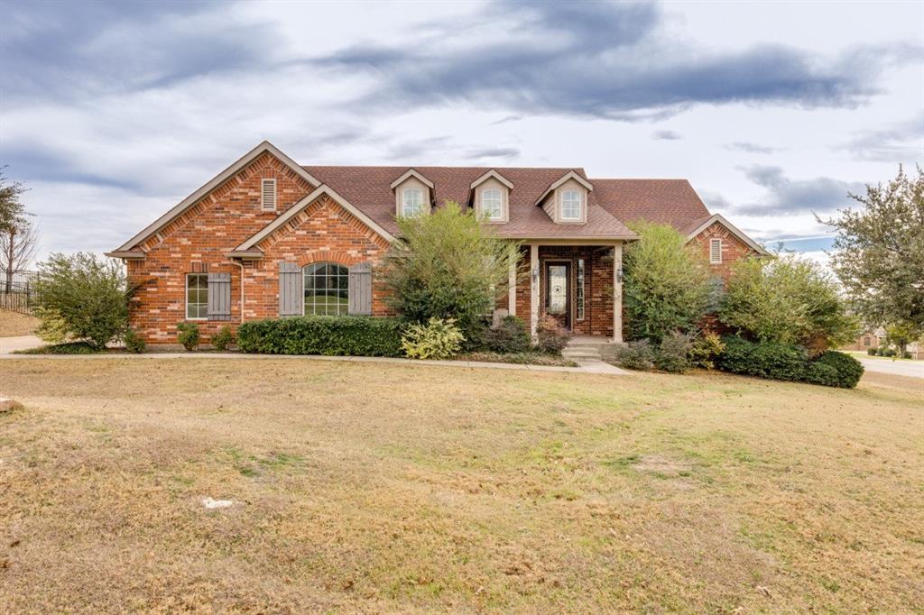 Enjoy one of the most breathtaking views in Fort Worth! Perched on a hillside overlooking Eagle Mountain Lake and the rolling Fort Worth landscape, this stunning single-story home is located in a gated community featuring a pool, park, playground, and serene ponds. The kitchen offers granite countertops, a walk-in pantry, and abundant storage. Two dining areas include a formal dining room with dual built-in hutches. A secondary living area features a built-in desk, perfect for a home office or study space.


The home boasts a split-bedroom layout, soaring ceilings in the main living area, and a spacious open entry hall. The primary suite is generously sized, with large windows showcasing the beautiful backyard and sweeping views. The en-suite bath includes a relaxing garden tub and separate shower. Two additional bedrooms are situated on the opposite side of the home near the oversized three-car garage. Covered front and back porches provide ideal spaces to enjoy the scenery. Conveniently located just 30 minutes from downtown Fort Worth.