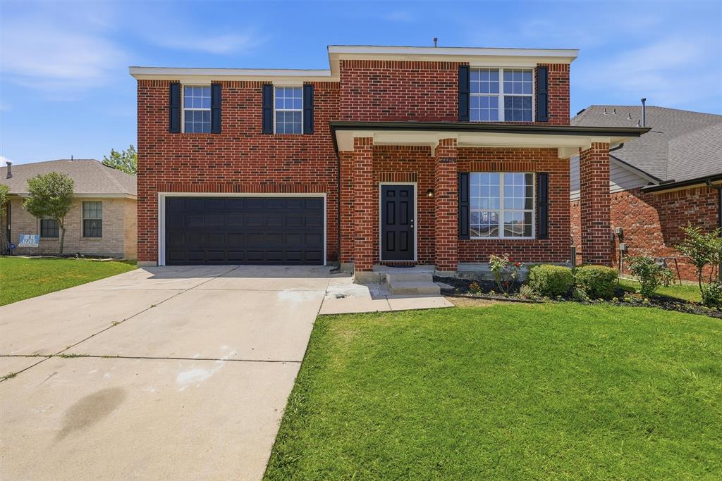 Beautiful, classic red brick home in quiet, friendly neighborhood.  Every room of this house has been remodeled — and you will love the choices! A stunning black front door welcomes you into this beautifully updated home featuring a totally remodeled kitchen with new appliances, gorgeous countertops and tile backsplash, and stylish finishes throughout.   Large family room with new stone facade on the fireplace adjoins the kitchen, giving great open space for gathering with your family and friends.  The large covered patio and backyard create the perfect setting for entertaining and outdoor gatherings. A beautiful black staircase leads upstairs to the bedrooms. Both bathrooms have been totally remodeled to perfection with elegant, modern touches. The neighborhood in excellent school district and with easy access to the entire DFW area.  This home blends charm, style, and functionality in every space!
