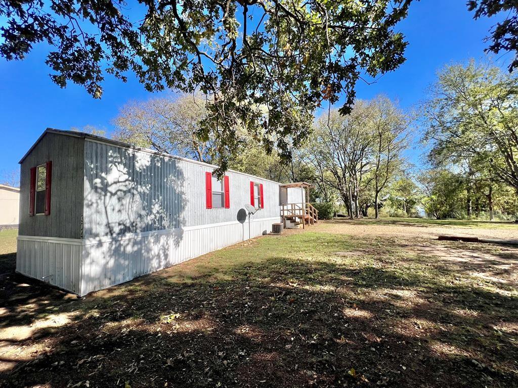 Charming and affordable home located in the heart of Gun Barrel City! Situated on nearly half an acre, this 3 bedroom, 1 bathroom property offers over 700 square feet of comfortable living space with a spacious yard perfect for outdoor enjoyment, entertaining, or relaxing evenings at home. The neighborhood features a variety of amenities including a community pool, park, basketball court, dog park, picnic area, fishing dock, and boat ramp, providing endless opportunities for recreation and leisure. Conveniently located near Cedar Creek Lake, shopping, dining, and local attractions, this property is ideal for first-time homebuyers, weekend getaways, or investment opportunities. Don’t miss your chance to own an affordable property with access to great community amenities in a desirable location. ***ALSO AVAILABLE FOR RENT @ $1,200 A MONTH***