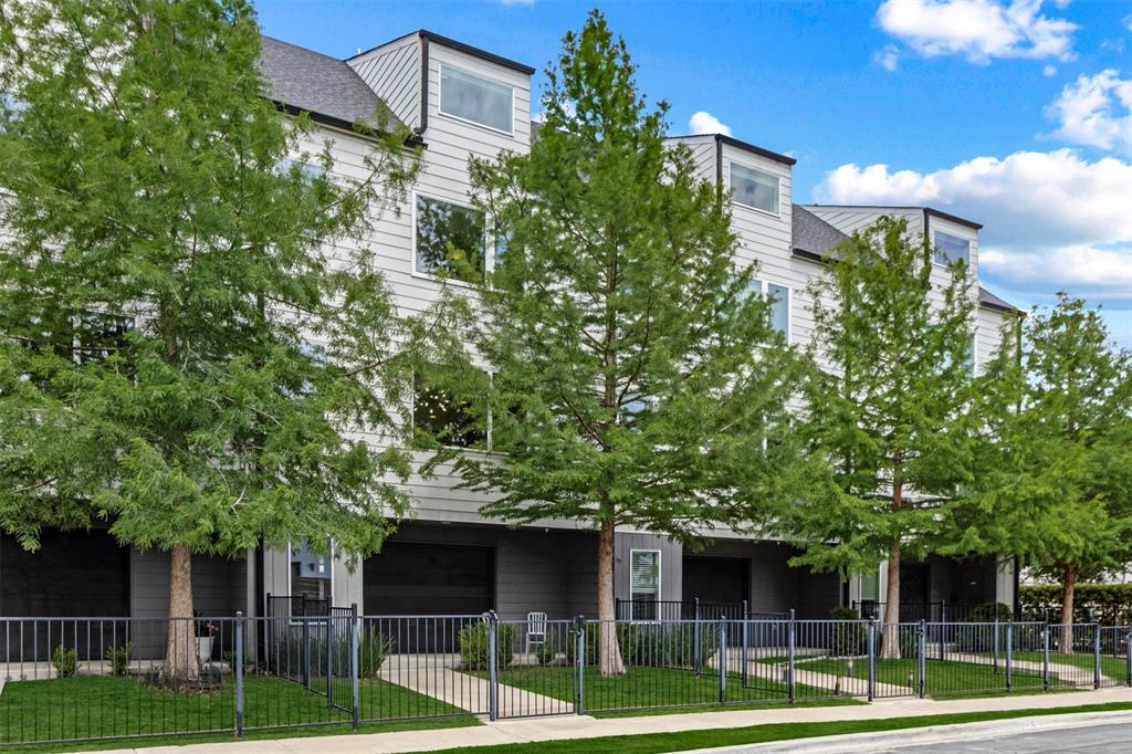 Perfectly positioned in the heart of Old East Dallas, this striking four-story contemporary townhome artfully combines sleek modern design with practical everyday living. Located just minutes from Uptown, Knox-Henderson, Lower Greenville, and the historic Swiss Avenue district, residents enjoy effortless access to some of Dallas’ premier dining, shopping, and entertainment destinations. Designed with an open-concept layout, the home showcases clean architectural lines, expansive windows, and an abundance of natural light throughout. The first level offers a welcoming entry, double door garage access, and a private yard ideal for effortless indoor-outdoor living. On the second floor, spacious living and dining areas create an inviting atmosphere, enhanced by large windows that flood the space with light and elevate the home’s bright, modern aesthetic. The third floor is dedicated to the primary suite, featuring downtown Dallas views, a spacious walk-in closet, and a well-appointed bathroom with dual vanities, a large shower, and built-in storage. The fourth level hosts a secondary bedroom with a private ensuite bath, providing comfort and privacy for guests or family. Every level is thoughtfully crafted to feel both elevated and effortlessly inviting. From its light-filled interiors to its unbeatable proximity to Dallas’ most vibrant destinations, this stunning residence is designed to impress at every turn.