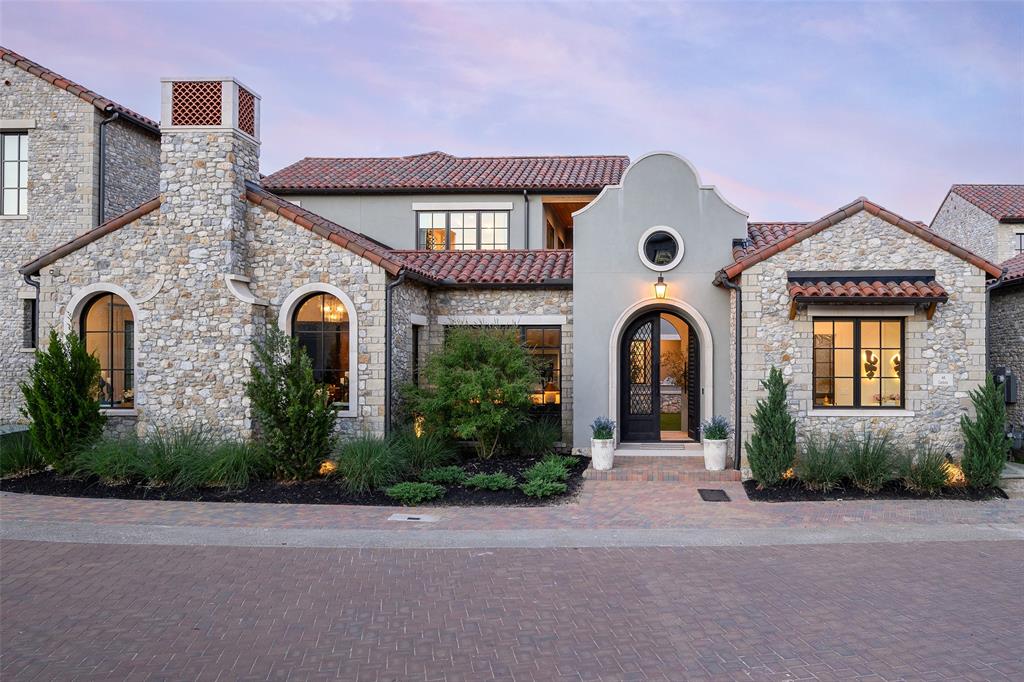 Inspired by the timeless villas of Catalonia, Spain, Villa Cardona is a striking expression of European architecture and modern luxury in the heart of Entrada at Westlake. Expertly appointed by Spenser Wayne Interiors, this approximately 4,950-square-foot residence showcases bespoke craftsmanship, artisan finishes, and refined design throughout. A private courtyard welcomes you to an exceptional indoor-outdoor living experience centered around a heated pool, outdoor kitchen, and detached casita, ideal as a guest suite, executive office, wellness studio, or private retreat. A fully integrated Savant smart home and whole-home audio system provide seamless control of entertainment throughout the residence. Inside, soaring ceilings and walls of glass fill the home with natural light. The main living area is anchored by a dramatic book-matched stone fireplace and flows effortlessly into a gourmet kitchen featuring premium appliances, a spacious scullery, and elegant dining space. The first-floor primary suite offers a peaceful retreat with a custom wood-paneled feature wall and tranquil views of the courtyard and pool. Upstairs, two additional bedrooms are complemented by a game room, media lounge or zen retreat, and a private terrace overlooking the outdoor living spaces below. Residents enjoy Entrada's walkable village-inspired lifestyle with restaurants, shopping, and entertainment just steps away, while remaining minutes from DFW International Airport and Southlake Town Square. Families benefit from the rare opportunity to choose between Southlake Carroll ISD and Westlake Academy. Blending the romance of Mediterranean design with the sophistication of contemporary living, Villa Cardona offers an exceptional lifestyle in one of North Texas' most desirable communities.