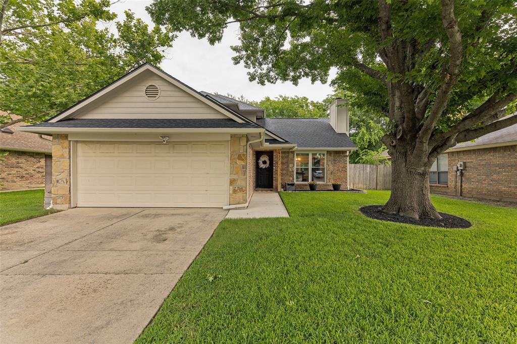 Thoughtful Upgrades Throughout. This beautiful home is meticulously maintained and move in ready. It has a warm, inviting layout with modern finishes and a functional floor plan designed for everyday living and entertaining. The remodeled kitchen and dining area flow seamlessly into a spacious family room highlighted by a gorgeous fireplace. Updates include new windows with a lifetime transferable warranty, a 30-year composition shingle roof, fresh paint, updated trim, interior doors, luxury vinyl plank flooring and a beautifully remodeled staircase.   The private downstairs primary suite features a split bath design, fully remodeled with dual vanities and a walk-in closet.  Upstairs, you'll find two additional bedrooms and a recently remodeled full bath tucked away for added privacy.  Outside, a mature oak tree provides beautiful shade and natural curb appeal.  Ideally located near Blue Haze Elementary and scenic walking trails leading to George Markos Park, with access to nearby shopping, dining, schools, and major Fort Worth corridors.