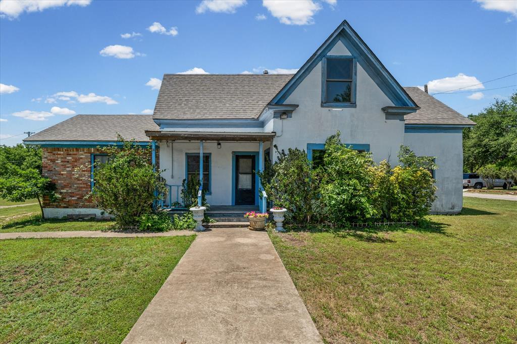 Step into this charming 3-bedroom, 2-bath home in McGregor full of character and opportunity. From the moment you walk in, the warm finishes throughout the home make it feel inviting and comfortable. The kitchen features rich wood cabinetry paired with sleek countertops and flows naturally into the cozy dining area, creating a space that feels perfect for everyday living or gathering with friends and family. The living areas carry a vintage feel that gives the home personality and warmth, while one of the bedrooms features a vaulted ceiling that adds extra openness and character. Upstairs, the additional bonus room offers flexible space for guests, a home office, or your own hobby room. Walking outside the home continues to impress with its classic stucco and brick exterior, spacious driveway with plenty of parking, and a wide lot surrounded by lush greenery that creates a peaceful setting to enjoy at the end of the day. Come and visit this timeless charm home in McGregor which offers a unique feel that’s hard to find and ready for someone to make it their own.