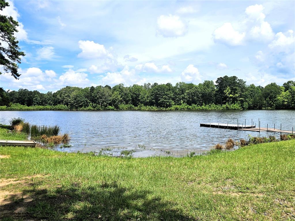 This home in the country provides privacy, seclusion and lots of room to move around inside and outside of the home.  Situated on an over acre corner lot in the gated neighborhood of Springhaven Estates.  Living here gives you access to the park that has a covered gazebo, fishing dock, and boat launch.  4 bedrooms, 2 bathrooms, 2 living rooms and 2 eating areas.  Kitchen is well thought out with a gas stove, center island and built in china cabinet and bar.  This home was purchased in 2023 and needed an overhaul.  The home had extensive upgrades and repairs including a new roof, retrofitted foundation, all new floors and a new hvac system along with fan and light fixture upgrades and paint on the interior.  There are 2 living spaces and 2 dining areas outside of the kitchen.  Remote master suite with a large bathroom with double vanities and a jetted tub. Exterior has a covered front porch and a large covered back porch and deck.  Sectioned off backyard that is fully fenced.  Remainder of the land is open and heavily shaded and beautiful.  Square footage is from previous purchase and believed to be accurate but not guaranteed, buyer to verify.  Owners are relocating and must let their home go.  Their move is your gain!