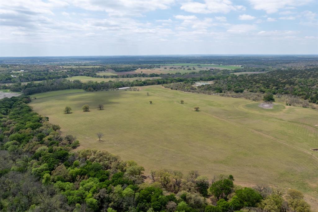 This 704-acre ranch in Jonesboro, TX offers a rare combination of natural beauty and functionality, with its eastern boundary along the Leon River providing a valuable water source and enhancing the property’s recreational appeal. A larger portion of the property has been cleared, making it ideal for grazing, hay production, or other agricultural uses, while the remaining acreage features native, lightly wooded terrain that supports abundant wildlife. The property also includes multiple ponds stocked with largemouth bass, adding to its recreational value and year-round enjoyment, as well as a 1,506 square foot single-family home on-site. The mix of open pasture and wooded cover creates an excellent setup for a recreational or hunting ranch, while also allowing for continued agricultural use. With its diverse landscape, water access, and privacy, this property is well-suited for a buyer seeking a versatile ranch for recreation, livestock, or a private retreat.