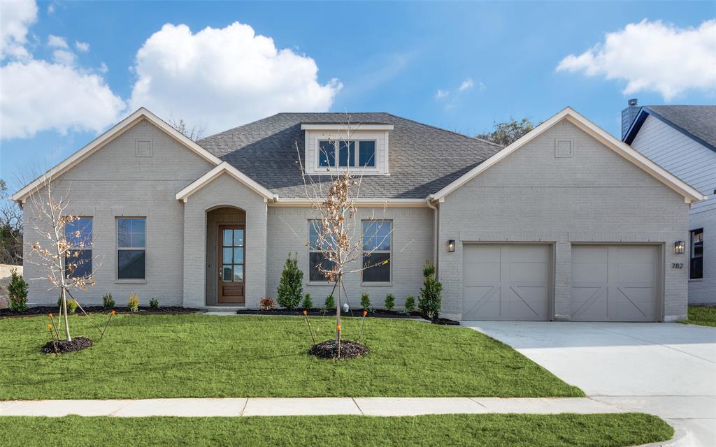Welcome to Brookside, where comfort and designer style come together in this beautifully crafted Clarity Homes residence. Luxury vinyl wood flooring flows throughout the entry, living room, kitchen, dining area, flex space, and hallways, creating a warm and seamless feel throughout the home.

The chef’s dream kitchen features a spacious eat-in island, stainless steel appliances, abundant cabinetry, and designer finishes perfect for everyday living and entertaining alike. The inviting family room centers around a cozy wood-burning fireplace, creating the perfect atmosphere for gathering with family and friends.

Retreat to the spacious primary suite featuring a spa-inspired ensuite bath complete with a large soaking tub, separate walk-in shower, designer lighting, and beautifully selected tile throughout.

Enjoy a full landscaping package with irrigation, adding both beauty and convenience to this thoughtfully designed home. Ask about current buyer incentives and available homes within the community!

Thoughtfully designed with both style and functionality in mind, this home offers the perfect blend of comfort, craftsmanship, and modern living.