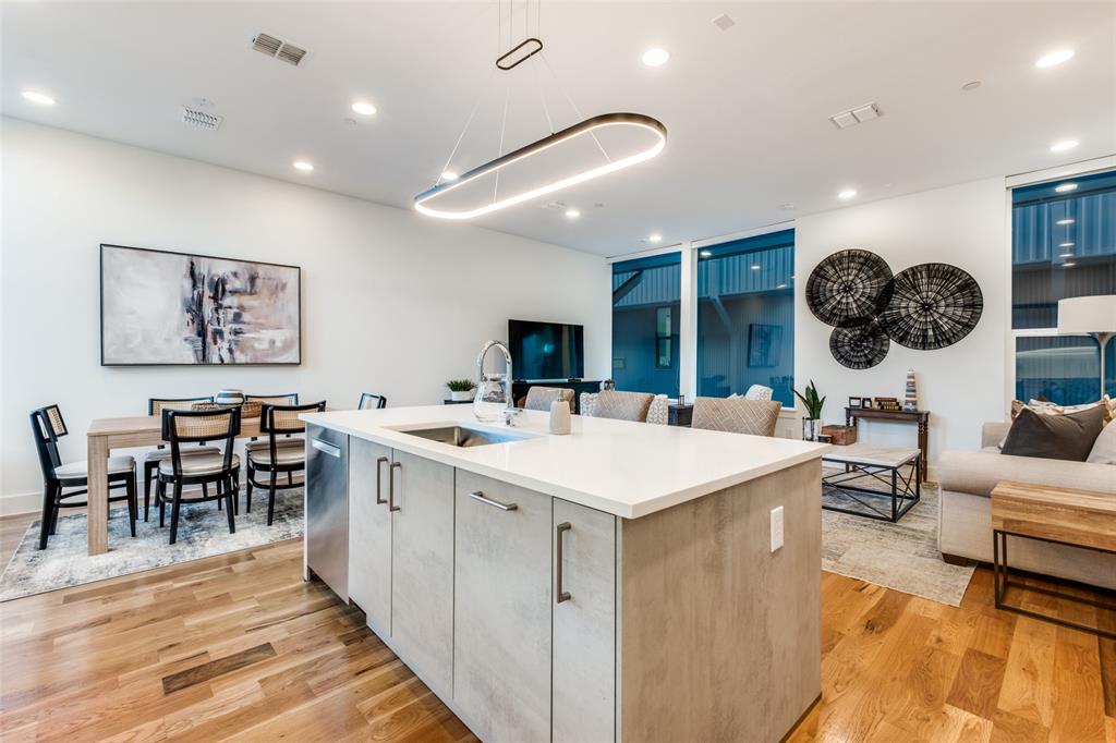 Experience upscale urban living in this 2-bedroom, 2.5-bath townhome designed by award-winning architects Far + Dang and built by Cobalt Homes. Located in a secure gated community, this home showcases clean, modern finishes and exceptional craftsmanship throughout.

Enjoy Downtown Dallas skyline views from your private rooftop deck, plus access to a community dog park for added convenience. The interior features solid-oak nail-down hardwood floors, quartz countertops, and premium Bosch appliances. The Nobilia German cabinetry with soft-close hinges, high ceilings, and smart home technology elevate the home’s modern appeal.

Additional highlights include a tankless water heater, EV charging outlet, and a two-car garage. Ideally located just five minutes from Lower Greenville, Henderson Avenue, Uptown, and Knox Street. Walking distance to Fitzhugh and Ross.