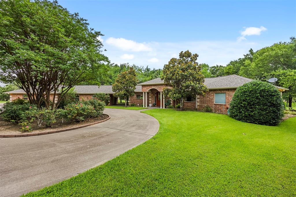 Experience a boater's or fisherman's paradise in this beautiful LAKE HOUSE, located in one of Corsicana's premier gated communities. Situated directly on the water, this lake house offers 3 bedrooms and 3 full bathrooms. The OVERSIZED PRIMARY SUITE serves as a private retreat, featuring a generous sitting area perfect for a reading nook, home office, or relaxing space with lake views. The open-concept layout showcases the peaceful lakeside setting. Outside, you'll find a rare 3-CAR GARAGE ALONG WITH AN ATTACHED WORKSHOP providing ample space for vehicles, hobbies, storage, or lake toys. Nestled within a beautiful GATED COMMUNITY known for its custom homes and scenic surroundings, this property offers the perfect blend of privacy, security, and lakefront lifestyle. Whether you're looking for a full-time residence or a weekend getaway, this exceptional waterfront property delivers the best of Richland Chambers Lake living.