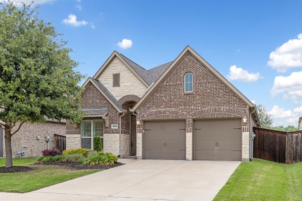 Designed to perfection, this stunning Perry Home in Trinity Falls is single-story and delivers a seamless blend of elegance, comfort, and modern sophistication. Surrounded by over 450 acres of natural open space, scenic hike-and-bike trails, parks, lakes, and vibrant community gathering spaces, and just minutes from historic downtown McKinney. Inside, soaring ceilings and abundant natural light create an open, airy feel throughout the thoughtfully designed 3-bedroom, 2-bath layout with a dedicated home office behind elegant glass French doors. Stylish upgrades include wood-look tile flooring, shutter blinds throughout, 8-foot doors, LED lighting, and ceiling fans in every room. Centered in home, the chef inspired island kitchen is designed for both everyday living and easy entertaining, featuring quartz countertops, a gas cooktop, stainless steel appliances, custom wood vent hood, modern white backsplash, pot-and-pan drawers, and a breakfast bar for additional seating. The spacious primary suite offers a relaxing retreat with a spa-inspired bath complete with dual sinks, soaking tub, walk-in shower with seating, recessed shower floor, and a generous walk-in closet. Step outside to enjoy the covered patio with ceiling fan and TV prewiring, overlooking a fenced backyard with green space and a shade tree, ideal for morning coffee, evening relaxation, or hosting friends and family. Additional conveniences include a mudroom entry from the garage, utility room with folding area, garage storage shelving, full sprinkler system, and underground-terminating gutters. Kitchen refrigerator and utility room washer and dryer may also be conveyed with the home. Trinity Falls residents enjoy exceptional amenities including resort-style pools, fitness facilities, co-working spaces, dog parks, event lawns, playgrounds, community events, grilling areas, and welcoming gathering spaces designed to bring neighbors together year-round.
