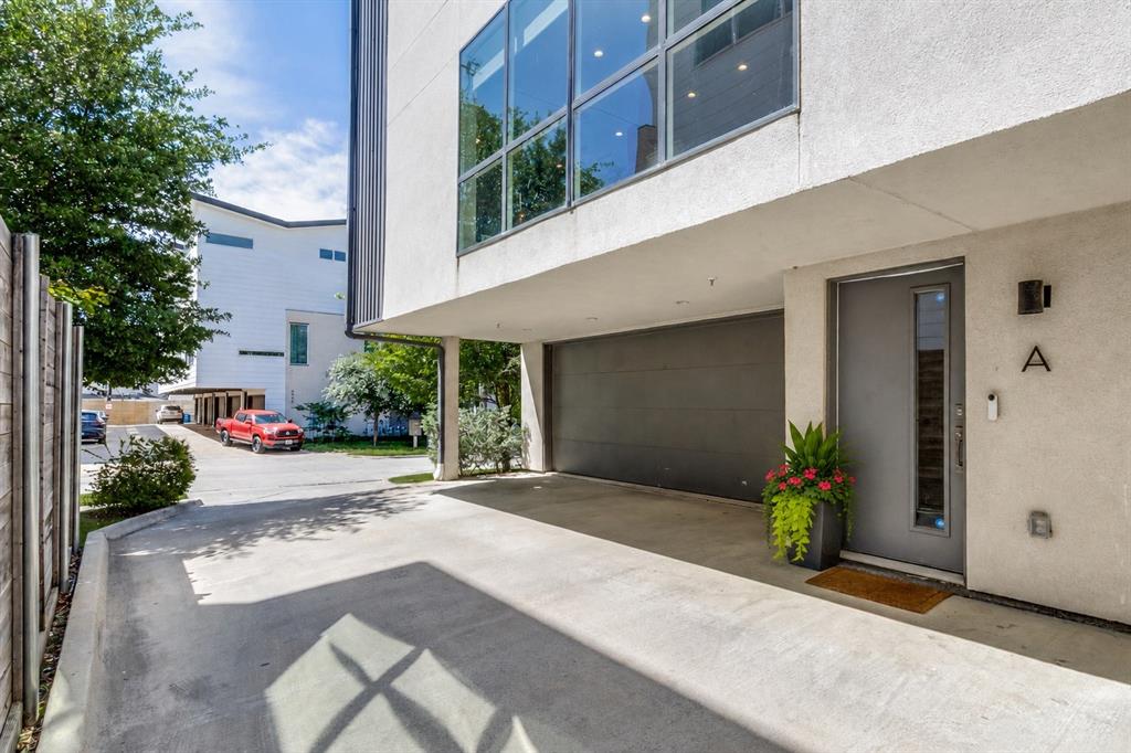 Rare end-unit residence in an intimate four-unit community just steps from Lower Greenville, offering exceptional privacy with no shared living walls, abundant natural light, a private fenced yard, expansive rooftop terrace, and versatile bonus living spaces rarely found in a two-bedroom home.
Designed for effortless everyday living and entertaining, the open-concept main level features seamless kitchen, dining, and living spaces anchored by quartz countertops, stainless steel appliances, an oversized island, walk-in pantry, and powder bath.
Upstairs, both bedrooms offer ensuite baths and walk-in closets. The spacious primary suite includes dual vanities, a soaking tub, separate shower, and generous storage, while a full-size laundry area adds convenience on the second floor.
The standout third level functions as a true flex space, complete with a private living room, wet bar with wine fridge, dedicated office area, half bath, and direct access to the rooftop terrace with retractable awning and gas hookup. Ideal for guests, a media room, home office, or an additional living space to fit your lifestyle.
Outside, the fenced and turfed yard extends the living experience with a custom pergola, grilling area, and room to relax. Additional highlights include an attached two-car garage with transom windows, under-stair storage, and a lightly lived-in, meticulously maintained interior — all moments from the restaurants, shopping, and nightlife of Lower Greenville.