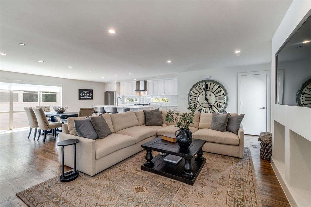 Rare end-unit residence in an intimate four-unit community just steps from Lower Greenville, offering exceptional privacy with no shared living walls, abundant natural light, a private fenced yard, expansive rooftop terrace, and versatile bonus living spaces rarely found in a two-bedroom home.
Designed for effortless everyday living and entertaining, the open-concept main level features seamless kitchen, dining, and living spaces anchored by quartz countertops, stainless steel appliances, an oversized island, walk-in pantry, and powder bath.
Upstairs, both bedrooms offer ensuite baths and walk-in closets. The spacious primary suite includes dual vanities, a soaking tub, separate shower, and generous storage, while a full-size laundry area adds convenience on the second floor.
The standout third level functions as a true flex space, complete with a private living room, wet bar with wine fridge, dedicated office area, half bath, and direct access to the rooftop terrace with retractable awning and gas hookup. Ideal for guests, a media room, home office, or an additional living space to fit your lifestyle.
Outside, the fenced and turfed yard extends the living experience with a custom pergola, grilling area, and room to relax. Additional highlights include an attached two-car garage with transom windows, under-stair storage, and a lightly lived-in, meticulously maintained interior — all moments from the restaurants, shopping, and nightlife of Lower Greenville.