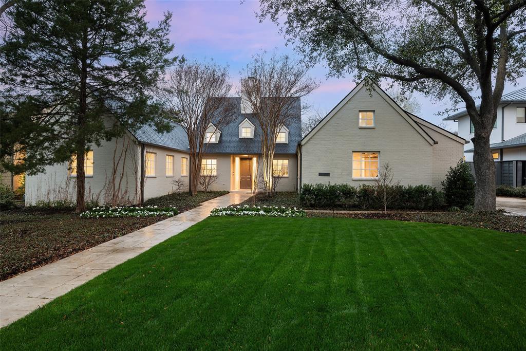 Located in the coveted Bluffview Estates, this exceptional home designed by Hugh Newell Jacobsen is set on nearly half an acre, showcasing his minimalist aesthetic with clean lines, symmetry, and a profound connection with nature. With a current refresh by McCabe Development, this unique one-story modern residence features a striking interior with 24 ft ceilings, advanced WAC art lighting, dual wood-burning fireplaces, & new hardwoods, stones, & cabinetry throughout. The chef’s kitchen is equipped with a full suite of brand-new Thermador appliances. The home's exterior is equally impressive, boasting lush landscaping, mature Oaks, an expansive patio, a striking 50-ft lap pool, and a Bocce Ball Court, with ample space for a pickleball court. Features such as a new roof & an oversized, air-conditioned garage blend practicality with luxury. Nestled in a famously walkable enclave known for its lush & unique topography, 4419 Bluffview Blvd offers a tranquil retreat in the heart of the city.