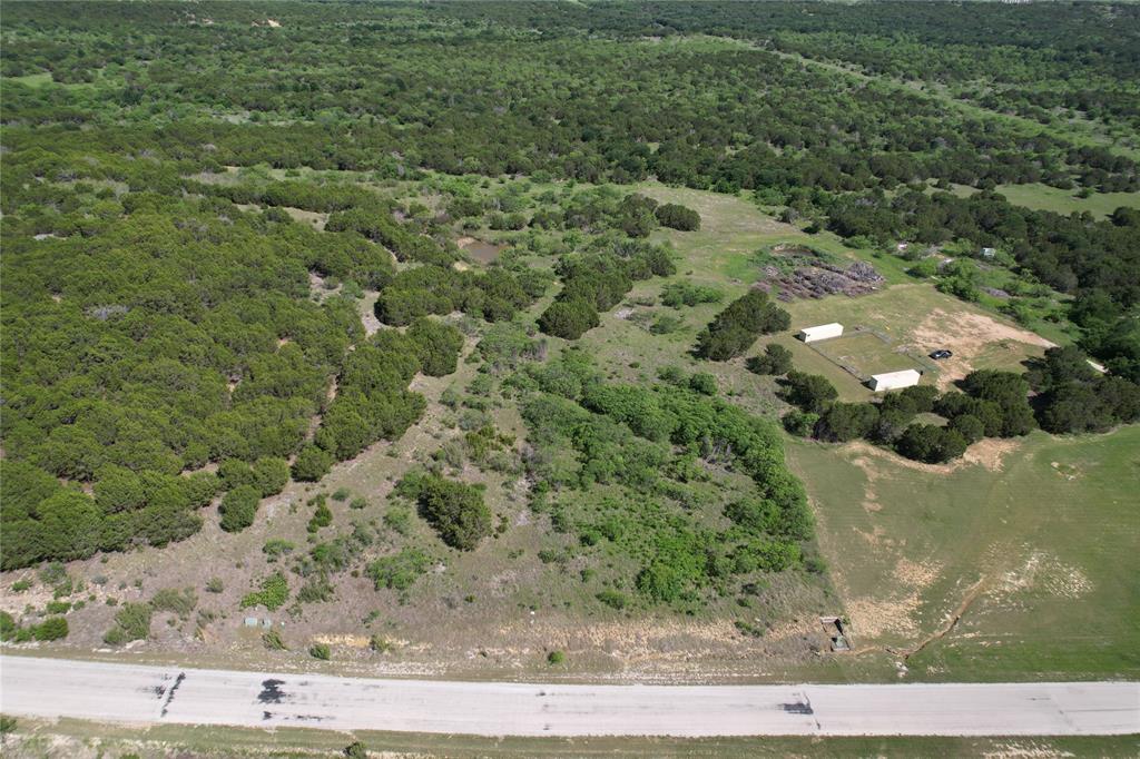 Five mostly level acres with a panoramic view. Property has a naturally occurring tank in the center. No time limit to begin building. Lot ownership permits the use of all of the neighborhood amenities including; clubhouse with pool and fitness center, boat storage area, boat ramp, community dock, lakefront cabin with restrooms and covered patio, lakefront area, park, fishing pond, hiking trail, and twenty miles of private road behind the gates.