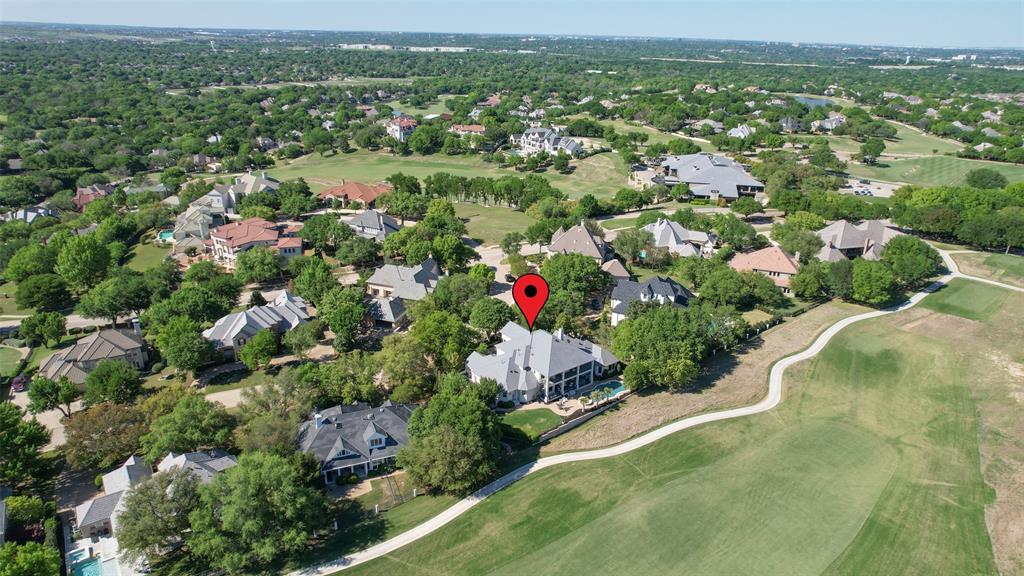 NEW PRICE! Exceptional golf course living in Mira Vista, beautifully positioned on a 0.45-acre lot overlooking the 10th fairway of the newly redesigned golf course. This impressive residence offers panoramic views, luxury amenities, and a thoughtfully designed floor plan featuring two primary suites, two dedicated offices, and an elevator for convenient access to all levels. Designed for both everyday living and entertaining, the home showcases spacious custom walk-in closets, a hidden panic room with front gate access, built-in warming drawers, an ice machine, and an electric pet fence surrounding the property. The climate-controlled three-car garage features new epoxy floors, a floor-to-ceiling workbench with butcher block countertops, and abundant storage. Outdoor living is equally exceptional with a heated saltwater pool and spa, creating a private resort-style retreat against the backdrop of the golf course. Major updates include a new roof and HVAC systems installed in 2022. Combining luxury, comfort, and outstanding functionality, this remarkable property offers an exceptional opportunity in one of Fort Worth’s premier gated communities.