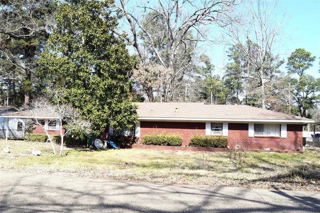 Large brick home on a slab that has so much to offer!!This home has 4 bedrooms, two baths, two kitchens with approx.1946 heated sq. ft. There is an extra large Den that previous owner used for a day care. It would make a great place for children to watch TV, play games and have friends over. The home has two kitchens. It could  easily be converted into a duplex, great place for room mates, or would make a nice mother in law suite.
The home has a large fenced back yard that is fenced off into two areas and a brick shop on a slab that is approx. 604 sq. ft. with two single garage doors with access to the street. This house will not go FHA,VA, or Rural Development. It needs to be cash, conventional or bank loan.