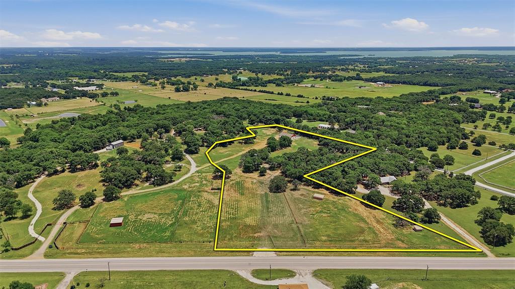 Mountain Springs Ranch is surrounded by large ranches and high-end properties in one of the most desirable locations of North Texas. This 8 acre property includes open pastures, mature trees, and sandy loam soil. With a new, dedicated entrance on FM 922, the ranch provides excellent access while maintaining a quiet, rural setting.  The land features approximately 40 feet of elevation change, adding character, views, and natural drainage.  Improvements include an 8 stall cinder block barn, a recently remodeled mobile home, and new perimeter fencing.  Electric and water are on site, allowing for immediate use. Whether you are looking to build a private estate or invest in a premier piece of North Texas land, Mountain Springs Ranch is both functional and inspiring.