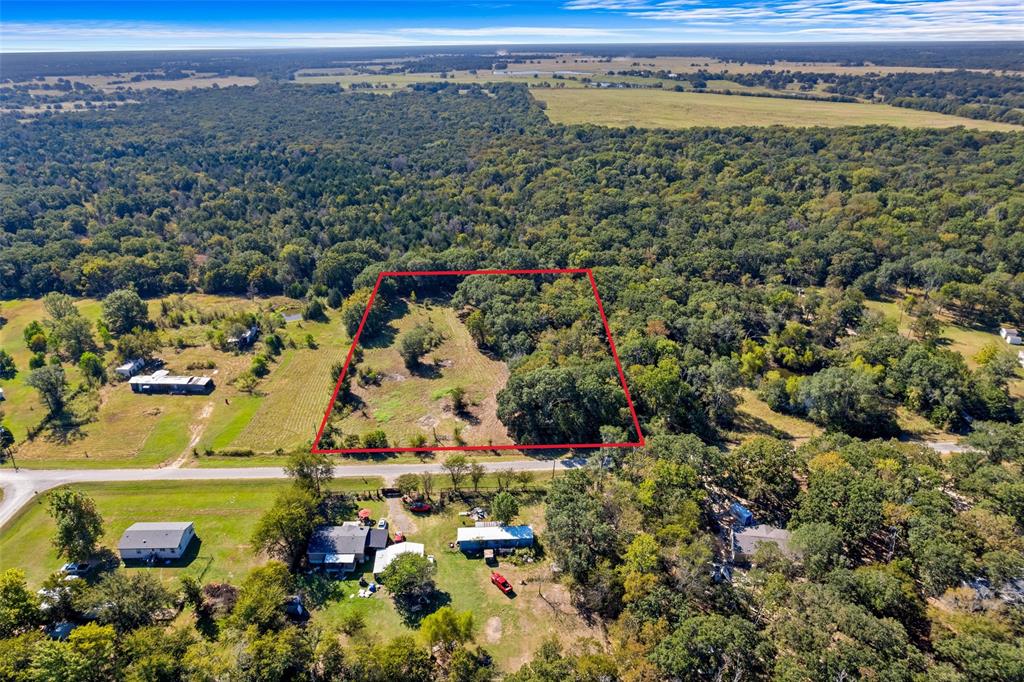 Nice treed lot in Kaufman county. Beautiful property with utilities at the street, needing a new water meter and a new septic system, this property has already been cleared for your new home site. Mobile homes are welcome. Deed restrictions are in the MLS documents, but are very relaxed, including no swine, no more than 15 chickens per acre, and homes must be at least 1000 sq. ft.  Come by and see the beauty of growing Kaufman county, the luxury of living outside of town, and the convenience of being close enough to Dallas.