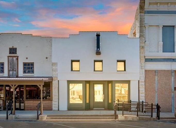 Prime downtown Hico commercial opportunity located in the heart of one of Central Texas’ most charming and rapidly growing destinations. Situated mid-block on historic Pecan Street, this approximately 2,825 sq ft building enjoys exceptional visibility and foot traffic along Hico’s thriving shopping and dining corridor. Neighboring landmarks include the iconic Midland Hotel & Chop House, Jersey Lilly’s, and a collection of popular boutiques, restaurants, and attractions that draw both locals and visitors year-round.

The property offers approximately 2,075 sq ft of finished retail or showroom space under HVAC, featuring an open-concept layout well suited for retail, office, gallery, event, or studio use. A renovated restroom, storage or back office area, updated plumbing, recent roof, and recent HVAC provide a strong foundation for immediate occupancy or future customization.

An additional approximately 750 sq ft warehouse or garage space includes electricity and a roll-up door, offering valuable storage, workspace, or inventory flexibility rarely found in downtown locations.

Rich in Hico history, the marquee-style “HICO” sign pays tribute to the building’s former life as a movie theater, adding character and nostalgic charm to this distinctive downtown property. 125 N Pecan is ready for its next chapter in the center of it all.