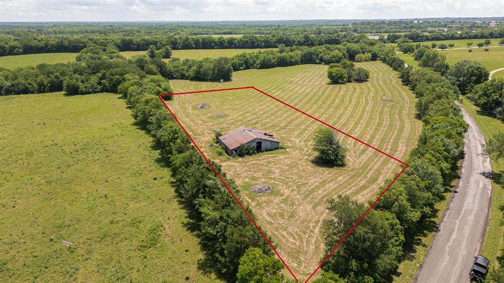 Beautiful acreage opportunity located on Lake Crook Rd with the option to purchase up to 5 acres . The property features a large barn, mature trees, and a clean setting with plenty of potential for future use. Conveniently located near Lake Crook with quick access to Highway 271 while still offering a private feel once inside the property. Water and electricity are nearby and the property is currently zoned agricultural. Area shows strong future growth potential with possible future industrial opportunities.