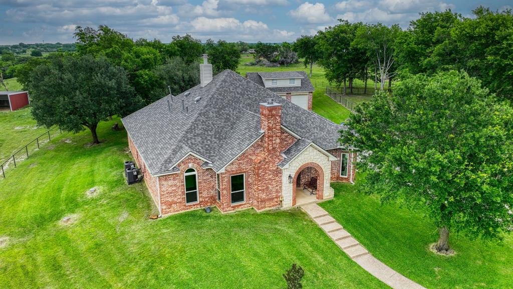 Welcome to The PT Ranch, a premier 138± acre property offering a rare blend of end-of-the-road privacy, prime Buffalo Creek frontage, and versatile improvements for ranching, equestrian, and residential use. Located in Johnson County just minutes from Cleburne and within easy reach of the DFW Metroplex, the property features open rolling pastures with mature hardwoods, abundant water, and a well-maintained residence.
Land highlights include 1,170 ft of Buffalo Creek frontage, a seasonal creek with potential for a private lake, 2 ponds, and fenced and cross-fenced pastures ideal for rotational grazing. Improvements include 5 loafing sheds, a set of heavy-duty pipe working pens, and abundant wildlife such as deer, turkey, and hogs.
Equestrian facilities include a 5-stall horse barn with a tack room featuring a sink and water heater, 2 indoor and 1 outdoor wash bays, a separate feed room, and a 25x60 covered awning for hay or equipment. The 30x40 insulated workshop offers electric service with water and sewer stubbed in and an attached 30x40 awning. 
The residence offers 2,690 sqft in the main home plus a 258 sqft loft above the detached two-car garage, connected by a covered walkway. Built in 1998, the home includes 4 bedrooms, 3.5 baths, a study, formal dining, and an open kitchen and living area with center island and built-in gas cooktop. Updates include a new roof (July 2025) and 2 new HVAC units (Sept 2025). Fully wired for network access. Entry features an electric gate and paved blacktop drive (March 2025).
The PT Ranch also offers an easement to a 60-acre coastal field, creating development or subdivision potential while maintaining ranch character. Local attractions & highlights include Lake Pat Cleburne, Cleburne Golf Links, and the Whistle Stop Christmas Parade, ranked among the state’s top events. Designed for both the cattleman at heart and the big-city businessman, The PT Ranch blends working ranch function, modern comfort, and investment potential.