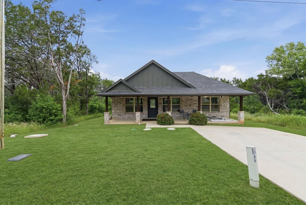 Welcome to this turnkey, meticulously maintained 3 Bed, 2 Bath home offering the perfect blend of comfort, privacy, and functionality. Situated on. 240 acres - one of the larger lots in the neighborhood, this property stands out with its spacious setting, thoughtful upkeep, and rare positioning with no neighbors to the right or left - creating an added sense of privacy and openness that's hard to find. With a covered front porch and inviting entry, inside you'll find a warm and inviting layout designed for both every day living and entertaining. Natural light fills the living spaces, while the well-appointed kitchen offers excellent functionality with all appliances conveying. The primary suite provides ample space and an en-suite bath, while the additional bedrooms offer flexibility for guests, home office, or growing families. Step outside to enjoy the expansive backyard, enhanced with a brand new fence and covered back porch, and an additional outbuilding and shed with electricity. Whether you envision gatherings, an outdoor oasis, or simply enjoying the extra breathing room, the lot provides endless possibilities. Property extends past fence - see survey. Conveniently located 10 minutes from Downtown Granbury, less than 5 minutes from Lake Granbury, this home provides the benefits of a larger home-site, modern convenience, and exceptional upkeep into one incredible opportunity. Seller is willing to include furnishings with an acceptable offer, or purchased separately through a Bill of Sale, truly making this a turn-key, move-in ready home. Whether you are a first time home buyer, downsizing, or searching for an investment property, this home checks every box. **SPECIAL FINANCING AVAILABLE + LENDER CREDIT**