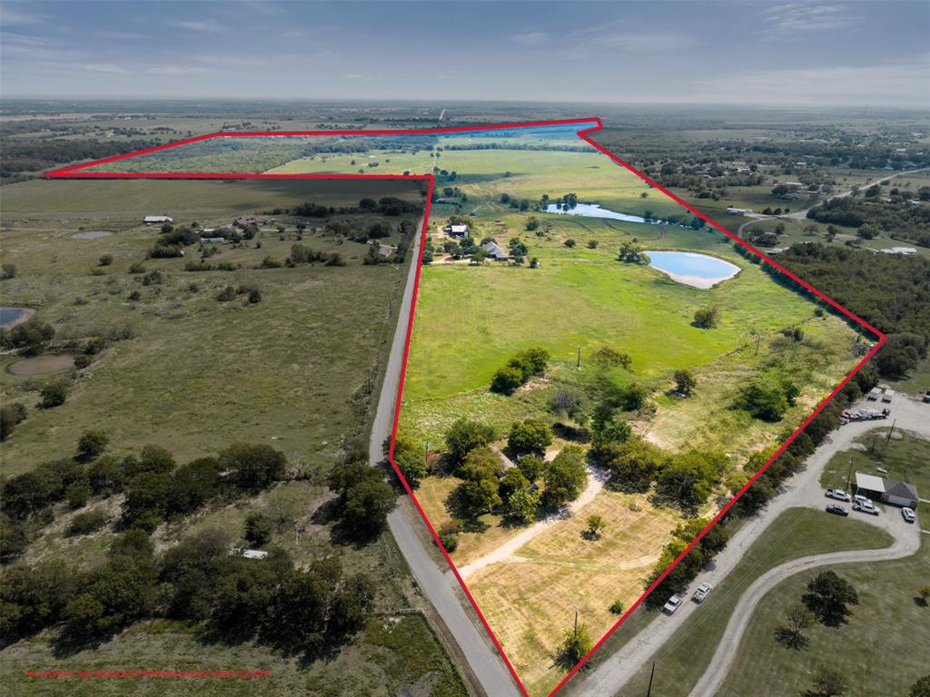 Just outside of Dallas in the rolling countryside of Kaufman County, this extraordinary 425± acre ranch offers the perfect blend of agricultural productivity, recreational opportunity, and modern rural living. Situated within the highly regarded Crandall ISD, Downey Ranch provides easy access to Dallas while feeling worlds away — a private haven for ranchers, sportsmen, or those looking for quiet country living.

• 3 spacious bedrooms, 2.5 bathrooms
• Large 2-car garage with ample storage
• Wraparound porch offering stunning views of open pastures and two of the ranch’s largest fishing lakes
• Elevated homesite ensures privacy, breezes, and panoramic sunsets
• A 70’x40’ older metal shop and a 55’x50’ barn are located within walking proximity of the home. 
• 350± acres of improved Bermuda and native grasses, well-suited for cattle grazing
• 115± acres of mature hardwoods, providing exceptional wildlife habitat and shaded areas
• Fully fenced and cross-fenced with barbed wire
• An extensive internal ranch road system provides easy access to all parts of the property
• Two large lakes near the home (2.5± and 1.5± acres) — both stocked with bass, catfish, and bream. Great fishing!
• Over half a mile of frontage on Big Brush Creek — a beautiful, secluded creek bottom that serves as a natural wildlife corridor and sanctuary.  
• 5 additional livestock tanks strategically placed for livestock. 
• Easy access to major roads and highways — just minutes from Crandall and Forney…less than 30 miles from Downtown Dallas. 
• Crandall ISD
• Private and secluded with a truly remote feel, yet close to schools, services, and amenities. 
• Rural Water, Septic, Propane
•  Ag Exempt
•  No energy leases or major transmission lines. 

*Less than 30 miles from Downtown Dallas.

Additional acreage is available for those seeking a larger tract.