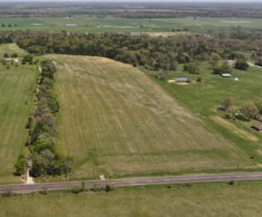 Just over 18 acres in east Denison. Agriculture exemption in place. Fully fenced with pipe entry gate. Oak Ridge South Gale water available at the road.  This 18 acres is also listed as part of a 61 acre property that includes house and shop. See MLS listing 20878706.