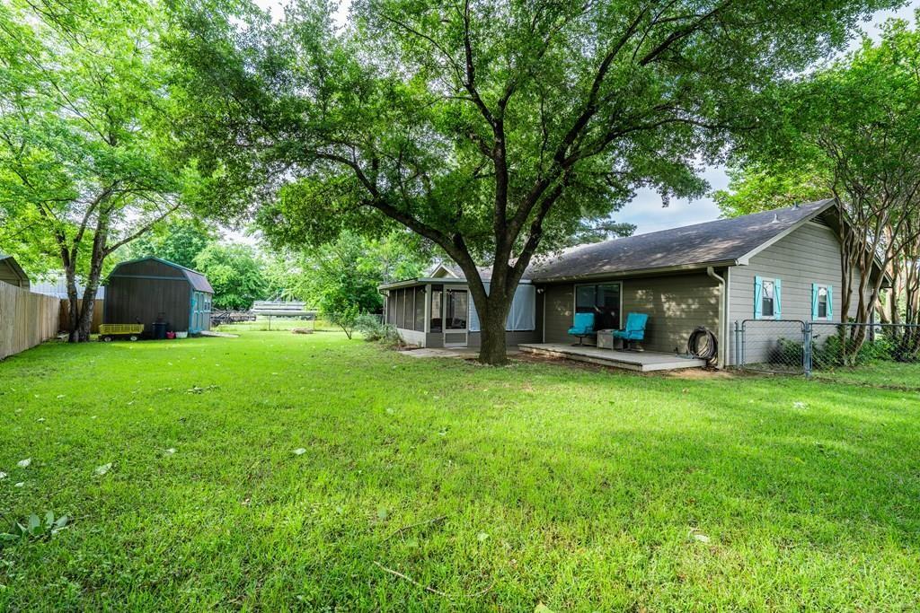 Motivated Seller!  Water view home with mature trees and fenced yard in established neighborhood on the shores of Cedar Creek Lake. This property is brilliantly designed and offers low maintenance tile flooring throughout, huge living area, separate dining room, spacious kitchen and screened in porch with new deck out back. Seller added crown moldings and fresh paint throughout the home. Huge backyard and fully fenced for kids, pets or privacy.  House is being sold with all appliances in the kitchen. Furnishings throughout the home are all negotiable.