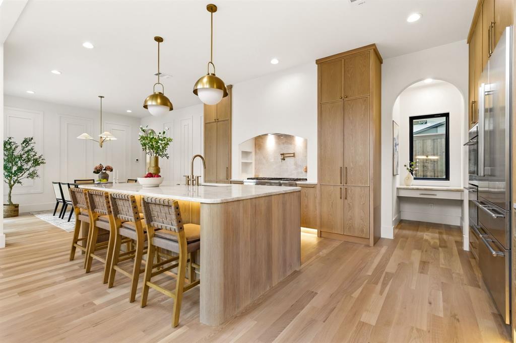 Step into a Newly Completed Home that blends modern design with everyday comfort and standout craftsmanship. From the moment you arrive, the striking brick and stucco exterior, paired with a grand glass pivot entry door and sleek metal-and-glass garage, sets a bold, contemporary tone.
Inside, a dramatic two-story living room filled with natural light creates the perfect space for entertaining, complemented by seamless indoor-outdoor flow through out swing patio door.. White oak flooring runs throughout, adding warmth and sophistication to the open-concept layout.
The chef’s kitchen is a true centerpiece, featuring custom white oak cabinetry, premium Thermador appliances, and a separate butler’s kitchen—ideal for hosting and everyday convenience. A first-floor guest suite or office adds flexibility, while the luxurious primary suite offers private backyard access for a peaceful retreat.
Designed for modern living, the home includes a fully integrated smart home system, built-in audio in key living areas, and dedicated laundry rooms on both levels.
Step outside to your private resort-style oasis, complete with a heated pool and spa, a stunning waterfall feature, outdoor kitchen, and low-maintenance turf landscaping—perfect for year-round enjoyment.
With thoughtful details throughout and high-end finishes at every turn, this home delivers the ideal balance of style, function, and comfort for today’s buyer.