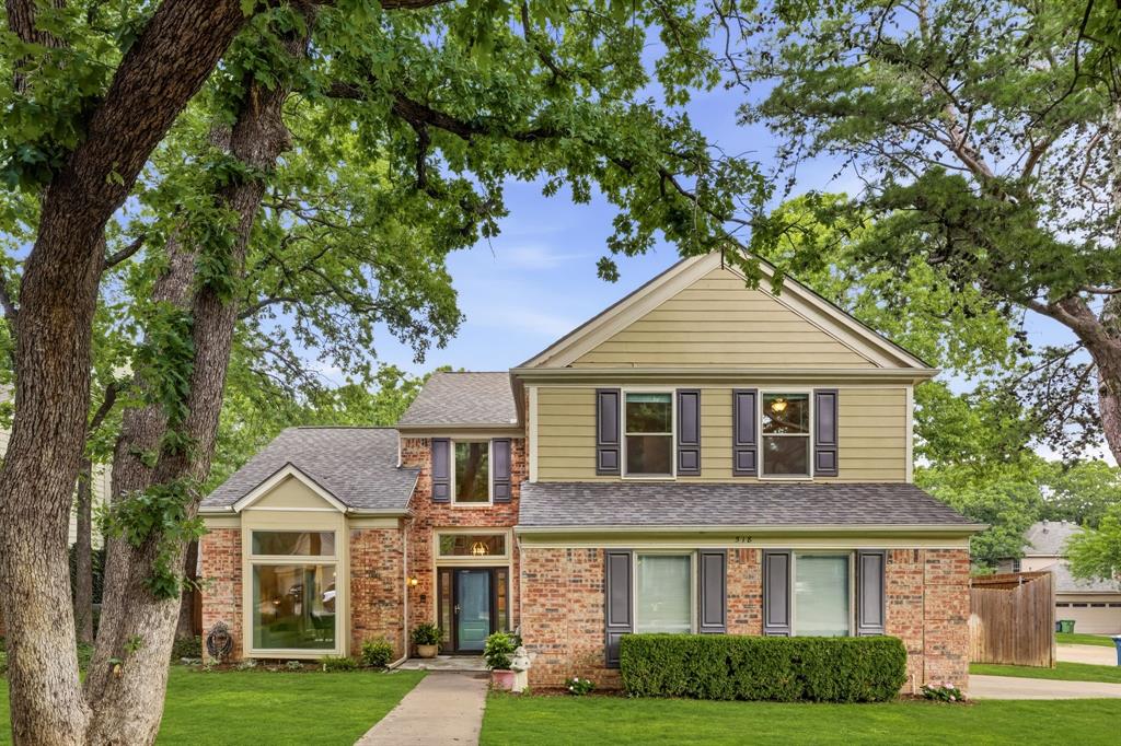 Pool parties, movie nights, and so many upgrades. Welcome to the neighborhood! 4 bedrooms, 3 full baths, a dedicated office, and a pool — plus so many updates since 2019. Tucked into Glade Crossing (no HOA, but real community spirit — movie nights, neighborhood gatherings, the works), this home has new windows (2021), new HVAC (2023), new roof (2024), resurfaced pool (2025), and fresh carpet (May 2026). The big stuff is done.
The layout earns its keep. The office with its own full bath sits just off the entry — ideal for working from home or hosting guests. The kitchen opens to the main living room, where a wood-burning fireplace and built-in shelving create the kind of space people naturally drift toward. All four bedrooms are upstairs, keeping the main floor open and easy for entertaining. Out back, a covered deck overlooks the updated pool on a generous, tree-lined corner lot. Zoned to Grapevine-Colleyville ISD. Full improvements list available on the MLS.