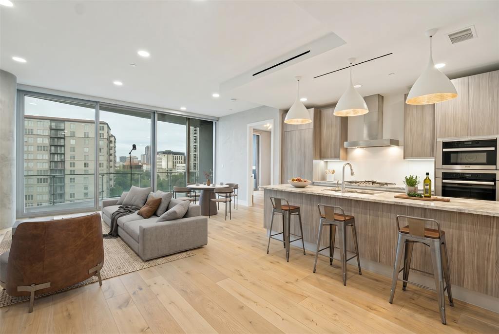 Meticulously maintained unit with incredible city views in the highly sought after Bleu Ciel Hi-Rise. This  2-bed 2.5-bath condo features an open floor plan with floor to ceiling windows, hardwoods throughout, decorative lighting and custom California closets and laundry area.. The kitchen features Miele appliances, Porcelanosa cabinets and marble countertops, providing a state of the art kitchen for any level of chef. The bedrooms feature black out shades, walk in closets and en-suite baths. This unit features a 396 square foot balcony providing a great space for morning coffee or a glass of wine in the evening. The building features unparalleled amenities such as two junior olympic size pools, a resident only spa, wine room, two executive board rooms, social room with library, private garages, fitness room with state of the art equipment, dog run, 24-7 concierge and valet, and direct access to the Katy Trail. This unit features a private two car garage.