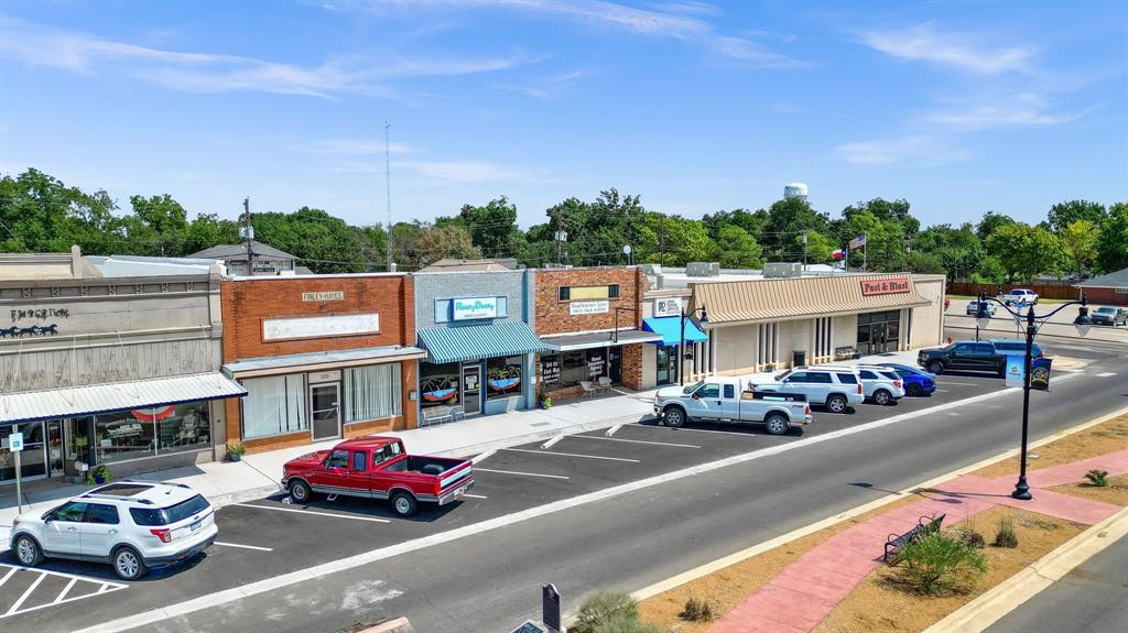 Looking for an amazing business opportunity in the heart of downtown Whitesboro, TX?  Classic 1900 year built building has approx. 2300 sq ft.  Newer metal roof completed in September 2019. Front showroom space 19x16 and approx. 21 x 12 hallway opens to more office space 37x21 and an individual office for your privacy. Floors are tiled and concrete. Individual work office approx. 8X9. Located in the back additional showroom or office space  20x13. 2 bathrooms one with handicapped accessibility. Additional approx. 12 ft tall and 8x8 outside storage is handy for extra storage.  Whitesboro has that small town atmosphere where everyone loves to come. Whether it's the Peanut Festival, Lunch at Lovejoy's, or shopping for that special someone, Whitesboro, Texas is becoming the small town get together place.