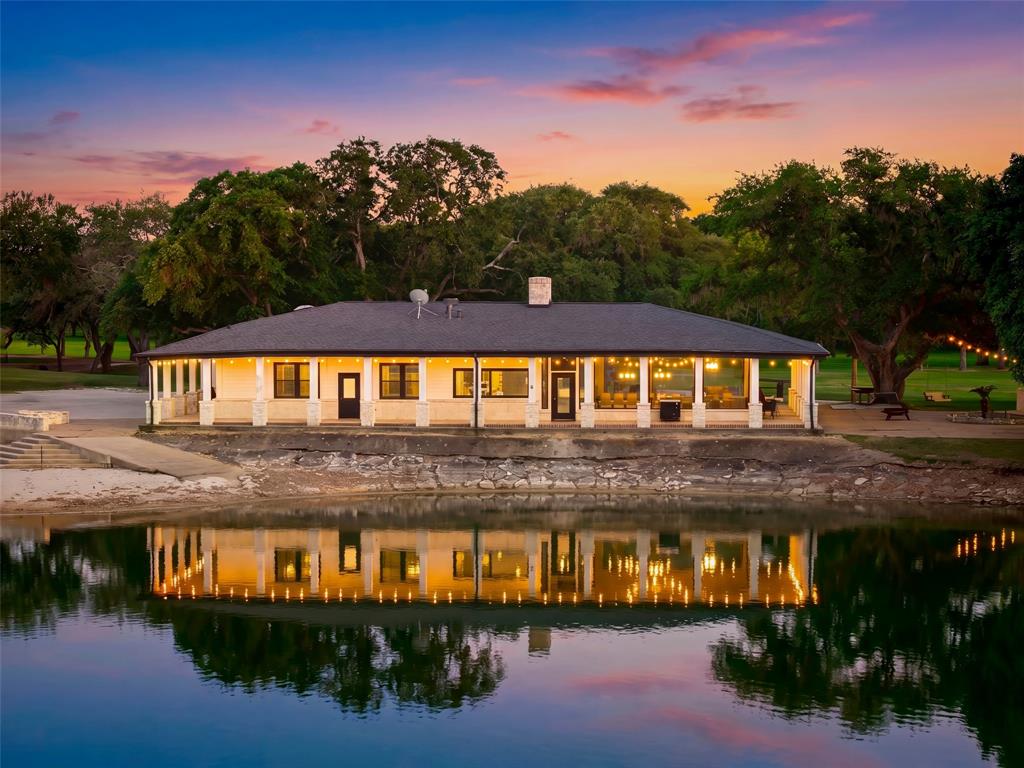Ehrman Ranch is a rare nearly 200-acre offering in Wallis, Texas, located less than an hour from downtown Houston.
The property features approximately 0.75 miles of frontage along State Highway 60 and approximately 0.5 miles of
frontage along the San Bernard River, creating a highly desirable dual-frontage configuration that is increasingly rare in
this corridor. Improvements include a 2,500± SF four-bedroom, two-bath waterfront lodge overlooking a private 15-
acre lake, supported by multiple guest and operational structures including a three-bedroom guest house, caretaker’s
residence, and barndominium with workshop space. The property has been successfully operated as an incomeproducing retreat with strong short-term rental and hospitality potential. Additional features include a gated entrance,
oak-lined drive, commercial-grade water well, and diverse terrain consisting of pasture, wooded areas, and river
corridor habitat supporting hunting, fishing, and recreational use. Ehrman Ranch offers a unique blend of recreation,
income potential, and long-term investment value in one of Southeast Texas’ fastest-growing regions.