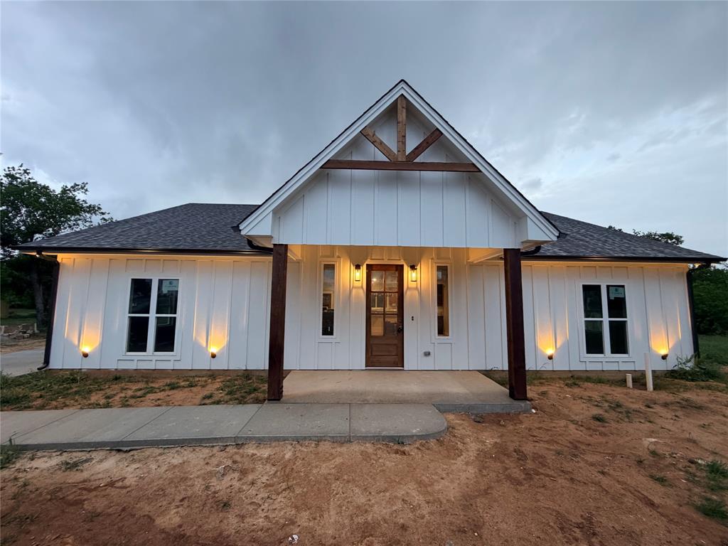 Welcome home to the cutest 3 bedroom, 2 bathroom new build on 1.55 acres. Farm house style home features an open living and kitchen area with stained cabinets. To the right in the home are two guest rooms with a full bath, and primary suite and bath are to the left. A large utility room with sink is in the back off the kitchen, and the back door opens to a covered two car carport or extended patio for entertaining. Home is energy efficient spray foam encapsulated, comes standard with ceiling fans in all rooms and irrigated sod and a landscaped front flower bed. Property is walking distance to Bowie High School and affords quick and easy access to HWY 287 for an easy commute. This one is worth the look! Builder did not take any shortcuts and added nice touches throughout the home that you will immediately notice from a standard new build.