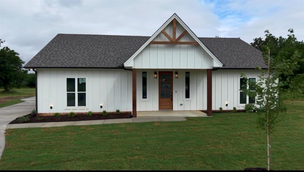 Welcome home to the cutest 3 bedroom, 2 bathroom new build on 1.55 acres. Farm house style home features an open living and kitchen area with stained cabinets. To the right in the home are two guest rooms with a full bath, and primary suite and bath are to the left. A large utility room with sink is in the back off the kitchen, and the back door opens to a covered two car carport or extended patio for entertaining. Home is energy efficient spray foam encapsulated, comes standard with ceiling fans in all rooms and irrigated sod and a landscaped front flower bed. Property is walking distance to Bowie High School and affords quick and easy access to HWY 287 for an easy commute. This one is worth the look! Builder did not take any shortcuts and added nice touches, like pretty trim work and soft close cabinets, throughout the home that you will immediately notice from a standard new build.