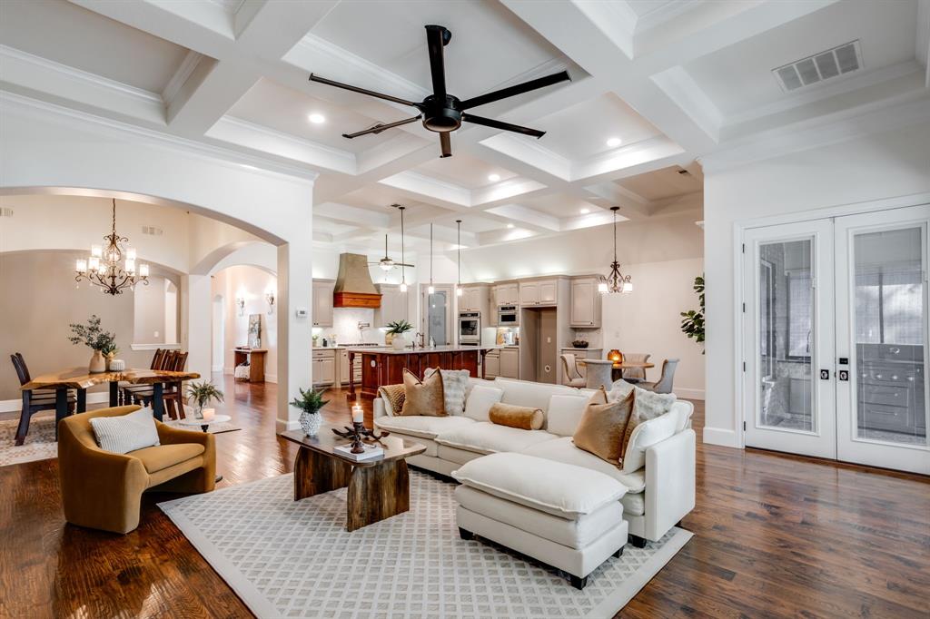 Luxury Lakefront Living on Lake Granbury’s Main Body! Experience one-story elegance in this 3,698 sq ft waterfront retreat designed for comfort and style. Featuring 4 spacious bedrooms, 3 full baths, a private office, and an oversized 3-car garage. This home blends luxury with everyday convenience. The gourmet kitchen boasts upgraded quartz countertops, KitchenAid appliances, pot filler at gas cooktop and walk in pantry.  This layout flows seamlessly into open living and dining spaces. A four-seasons room at the back offers panoramic lake views year-round. The primary suite is a true sanctuary with black out electric shades, a spa-inspired bath, soaker tub, walk-in shower, and oversized closet with built-in cabinetry. All bedrooms are generously sized with ample closet space; this home will surprise you with all the storage options! Outdoors, enjoy an entertainer’s dream: outdoor kitchen, rebuilt seawall, and private dock with lifts for boats and jet skis. Lake-fed irrigation keeps landscaping lush, while a majestic oak tree with sweeping branches provides the perfect spot for a swing and lots of shade. Additional highlights include all hard floors, no carpet, fancy glass doorknobs throughout, spray foam insulation, water filtration and reverse osmosis at the sink, and two tankless water heaters for efficiency. Located just minutes from Granbury’s historic square for dining and shopping, and only an hour from DFW.  This property offers the perfect blend of luxury lakefront living and convenience.