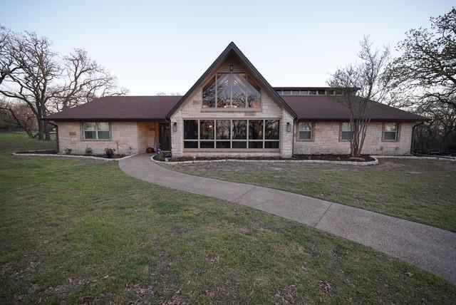 Beautiful home on over 15 acres three miles from town. 4 bedroom, three bath home has everything you want and more. Large open living and dining with vaulted ceiling. Tile, hardwood and LVP flooring. Three cross-fenced pastures, two Priefert stall horse barn and tack room. 8x10 chicken coop. Quartz countertops, built-in refrigerator. 30x40 insulated shop with a 30x15 loft. Ag Exemption in place. Private turnkey country living with space for horses or livestock just minutes from town.